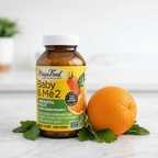 Prenatal supplement amber glass bottle arranged next to fresh organic orange and green leaves on white marble – More4less Outlet