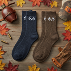 Carolina Ultimate Realtree wool blend crew socks laid flat on rustic wood surface with autumn leaves and hunting gear outdoor lifestyle