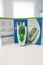 AccuRelief Dual Channel TENS device displayed beside open retail box on clean white surface