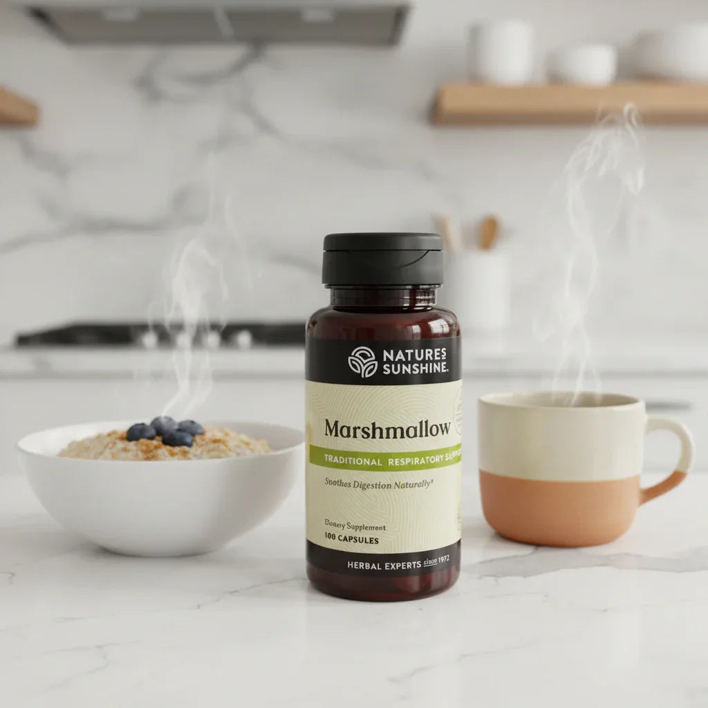 Nature's Sunshine Marshmallow Root bottle on modern white quartz kitchen counter beside white ceramic bowl of oatmeal and warm cup of herbal tea