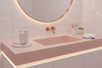Minimalist pink and white bathroom vanity showing premium women's shaving tools and grooming essentials