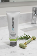 Mary Kay Clear Proof charcoal mask tube on marble bathroom counter with jade roller and rosemary — deep-cleansing activated charcoal face mask