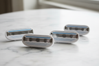 Close-up of Gillette Venus Smooth 3-blade razor cartridges with blue lubricastrip and protective cushions on white stone surface