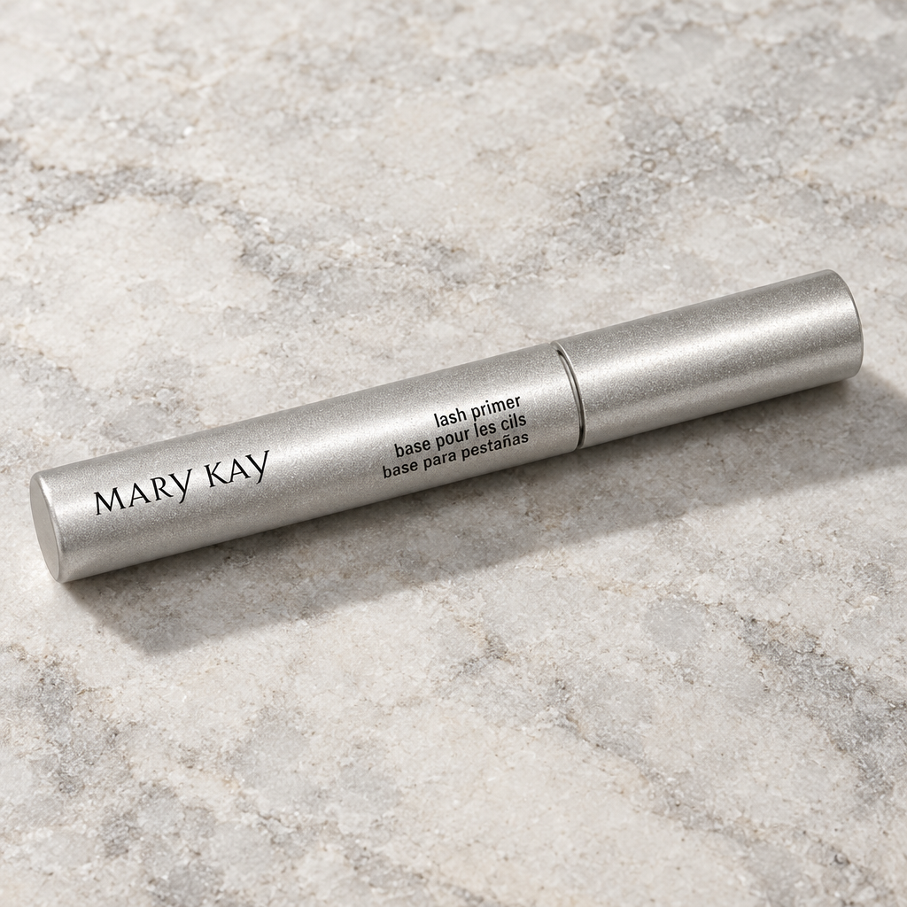 Mary Kay Lash Primer silver tube on a pale neutral stone surface