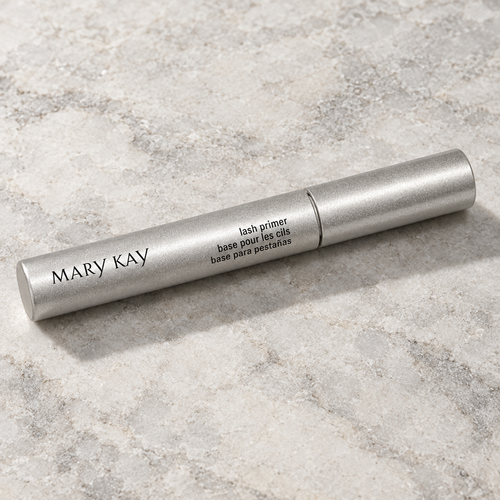 Mary Kay Lash Primer silver tube on a pale neutral stone surface