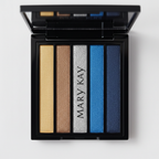 Macro close-up of Mary Kay Eye Color Palette Rock the Runway open compact showing five pristine metallic eyeshadow strips: bright gold shimmer, warm bronze-brown, classic silver glitter, vibrant cobalt blue, and deep midnight navy on white background