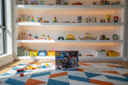 Hot Wheels Monster Trucks Arena Smashers Race Ace playset box on a shelf in an organized modern kids playroom