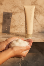 Mary Kay Cityscape Silkening Shower Gel creamy lather in hands under morning shower light - More4less Outlet