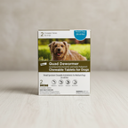 Elanco Quad Dewormer box for medium dogs 26–60 lb on a light wood surface