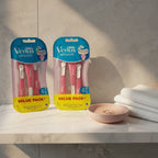 Gillette Venus Sensitive 12ct Value Pack on marble bathroom shelf with ring dish and cotton face towel