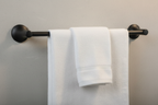White linen towel draped over Pfister Rhen matte black towel bar spa bathroom — More4less Outlet