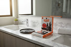 Wild Willies Wingman beard grooming accessories arranged on modern men's bathroom vanity with bright morning light