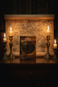 The Hobbit An Unexpected Journey 3D playing cards collectible tin on dark wooden surface with fantasy candlelight and Middle-earth map — More4less Outlet