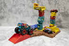Close-up action play scenario with monster truck on launcher ramp