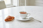 Bernardaud Organza saucer on marble dining table French breakfast aesthetic lifestyle