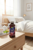 Nature's Way Umcka Syrup 4oz on light wood nightstand in bright bedroom near morning tea tray — More4less Outlet