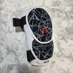 AI-generated contextual image of a G-Form Elite 2 baseball batter's elbow guard shown flat with adjustable straps