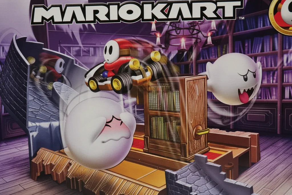 Close-up of Shy Guy die-cast car and track ramp mechanics