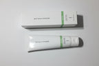 Studio lighting shot emphasizing Rodan + Fields SOOTHE Calming Gel Cleanser white packaging with green accent band