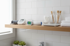 Wiselion infrared thermometer on modern bathroom wellness shelf with health monitoring items