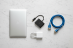 Belkin USB-C to VGA + Charge Adapter flat lay on marble with laptop, VGA cable, and USB-C charger — More4less Outlet