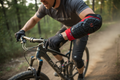 G-Form Elbow Pads Large worn by adult cyclist on mountain bike trail action shot