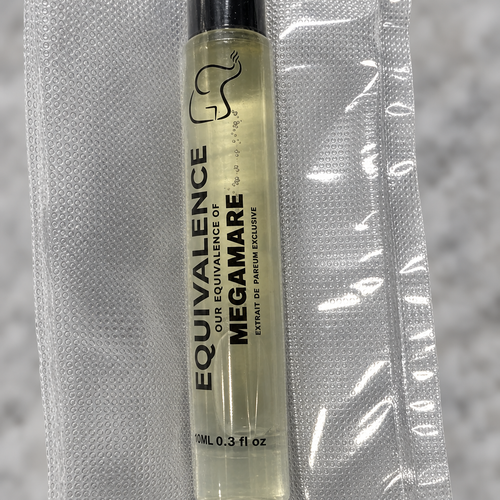 Macro close-up of the Equivalence Our Equivalence of Megamare Extrait de Parfum label and sealed pouch. At least one real product photo taken by Chad is included in the gallery. Remaining images are AI-generated lifestyle photos for visual context only. Minor label or packaging variation may occur between matching stocked units.