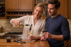 Couple using Houdini wine pourer and champagne sealer at home bar entertaining lifestyle - More4less Outlet
