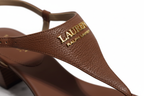 Close-up detail of gold-tone LAUREN Ralph Lauren logo hardware on Polo Tan tumbled leather T-strap sandal