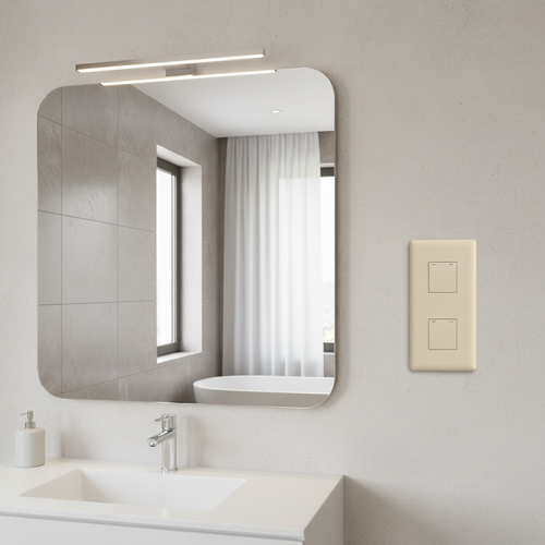 Clean modern bathroom wall with light almond triple rocker switch mounted beside mirror