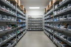 Organized shelves of high-quality appliance maintenance and replacement parts in a professional parts room