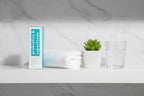 TULA Cult Classic cleanser on bathroom shelf with towel and plant lifestyle