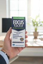 Focus Factor Extra Strength box in-hand close-up shallow depth of field bright office background