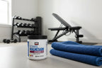 Force Factor Magnesium powder jar in gym setup with folded towel neutral morning light