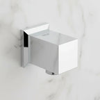 Macro detail of polished chrome Grohe Allure Brilliant plumbing supply elbow against neutral marble backdrop