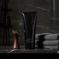 Lifestyle context image of Mary Kay Cityscape Hair and Body Wash (AI-generated for visual illustration only) – dark marble bathroom shelf with grooming accessories – More4less Outlet