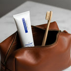 ZO Medical Oilacleanse 2oz travel size cleanser in luxury leather toiletry bag with bamboo toothbrush travel lifestyle