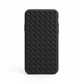 Studio shot of black silicone phone case with grid of suction cups on back on white background
