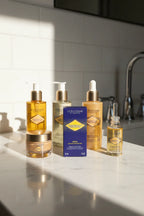 Natural sunlight reflecting off premium facial care products on a white marble bathroom countertop