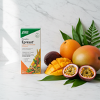 Salus Floradix Epresat Liquid Multivitamin box on white marble with fresh tropical fruits and green leaves.