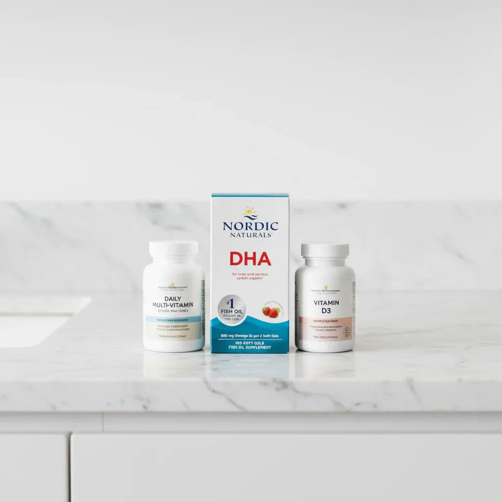 Daily vitamins and fish oil supplements resting on an immaculate marble health and wellness vanity