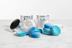 Blue teal velvet mini powder puffs next to luxury cosmetic jars setting powder marble — More4less Outlet