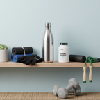 Organized health and fitness shelf with workout accessories, water bottle, and white amino acid supplement bottle