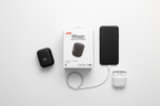 JVC Gumy SP-SG1BT wireless Bluetooth speaker black tech flat lay with phone earbuds and charging cable on white surface – More4less Outlet