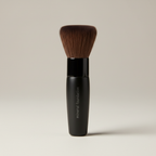 Mary Kay Mineral Foundation Brush standing on a neutral studio surface