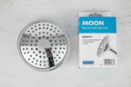Studio macro of chrome showerhead face-up on white marble showing precise nozzle distribution