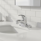 American Standard Colony Soft polished chrome faucet in contemporary minimal bathroom with white subway tile and soft morning light