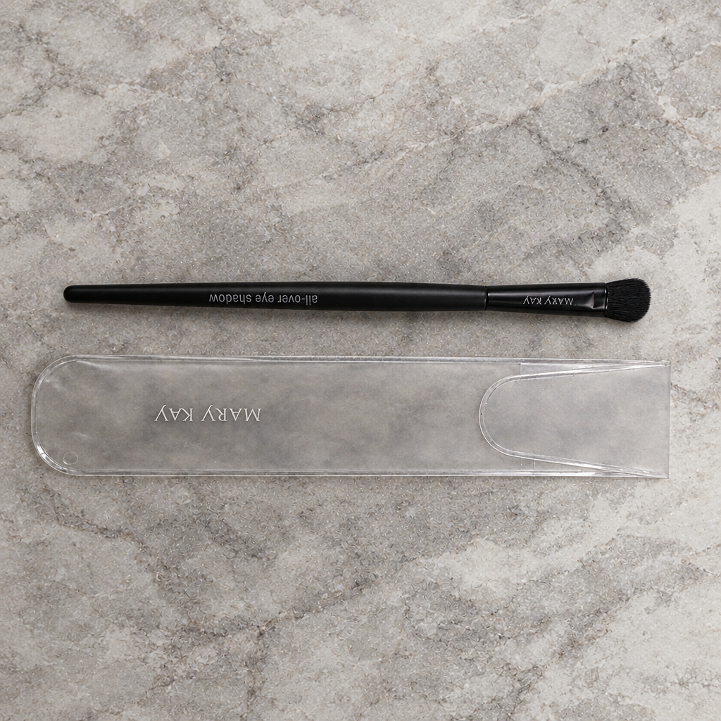 AI image of Mary Kay All-Over Eye Shadow Brush and sleeve on pale stone