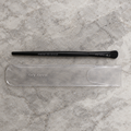 AI image of Mary Kay All-Over Eye Shadow Brush and sleeve on pale stone
