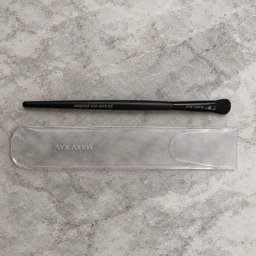 AI image of Mary Kay All-Over Eye Shadow Brush and sleeve on pale stone
